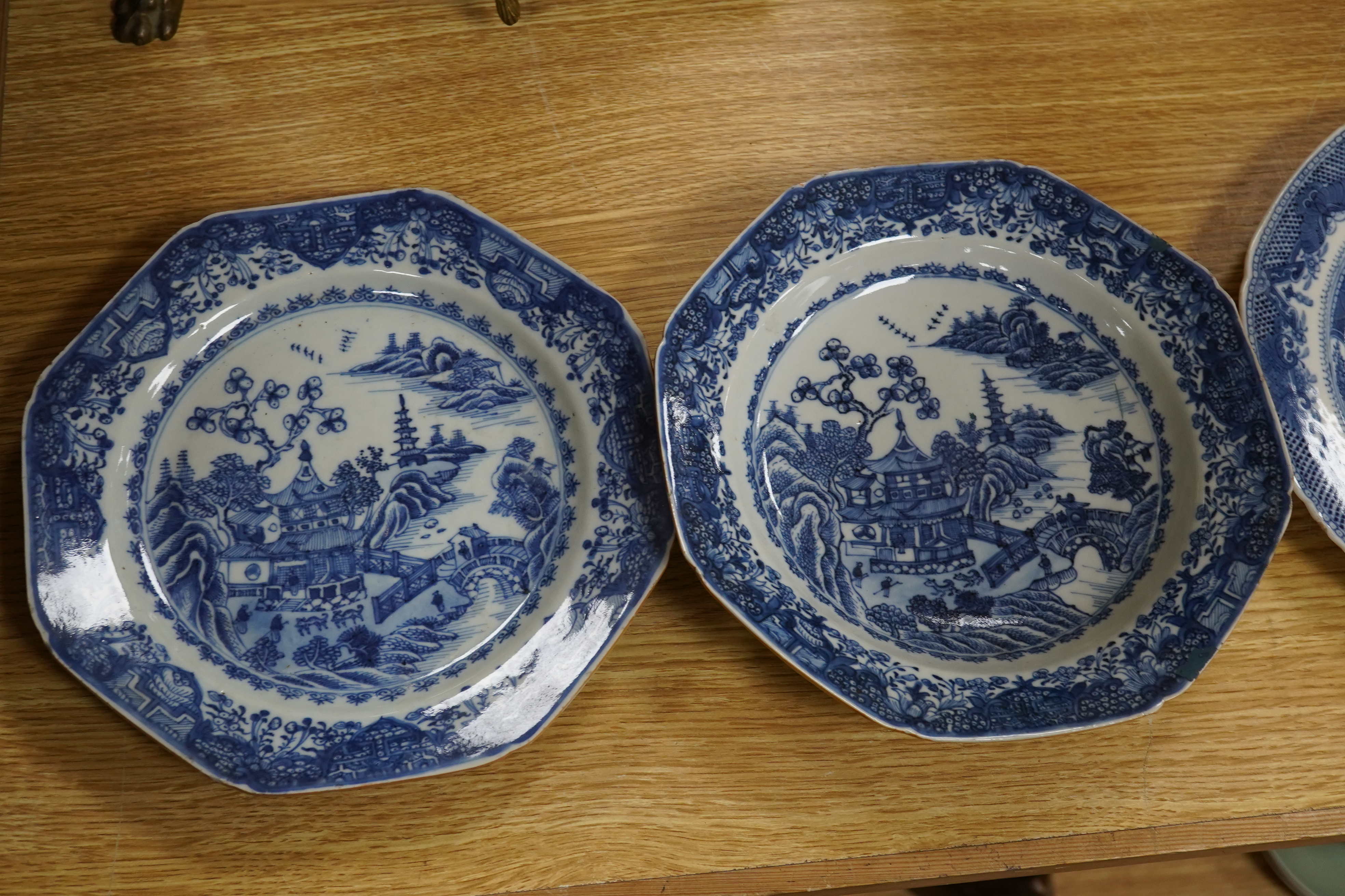 Five 18th century Chinese Export blue and white plates, largest 24cm diameter. Condition - all have varying amounts of damage